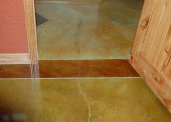 Concrete floor with acid stain finish in a home in Eads, Tennessee. Close-up of a concrete floor with acid stain finish in a residential interior.