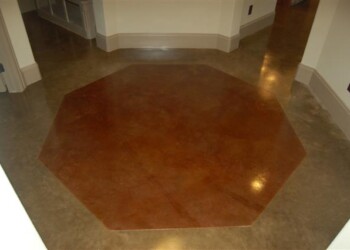 Octagonal acid stained concrete floor in a home, part of interior design. Interior concrete floor with an octagonal acid stain design in a residential home.
