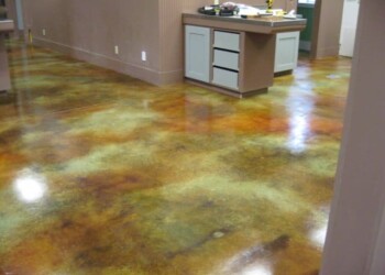Finished acid stained concrete floor in a kitchen in Eads, Tennessee. Interior view of a concrete floor with acid stain finish in a kitchen area.