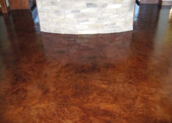 Finished acid stained concrete floor in a commercial interior in Eads, Tennessee. Interior concrete floor with acid stain finish in a commercial space.