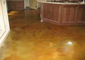 Finished acid stained concrete floor in a kitchen in Ephrata, Pennsylvania. Interior concrete floor with acid stain in a kitchen area.