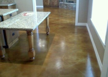 Finished acid stained concrete floor in a residential interior, part of a project by ECD Concrete in the local area. Interior view of a concrete floor with acid stain finish in a home.