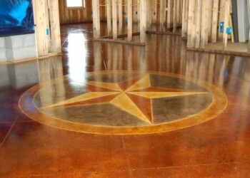 Polished concrete floor with a star design in a building under construction. Decorative star design on polished concrete floor in a construction site.