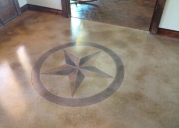Polished concrete floor with a star emblem at ECD Concrete in the town. Decorative star emblem embedded in polished concrete floor at ECD Concrete.