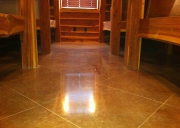 Finished polished concrete floor inside a wooden cabin or lodge. Polished concrete floor in a wooden cabin or lodge setting.