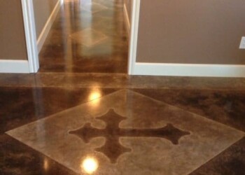 Decorative concrete floor with star-shaped inlay in a hallway. Decorative concrete floor with a star-shaped inlay in a hallway.