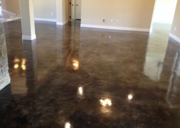 Finished acid stained concrete floor in a home in Euless, Texas. Interior of a room with freshly acid stained concrete floor in a residential home.