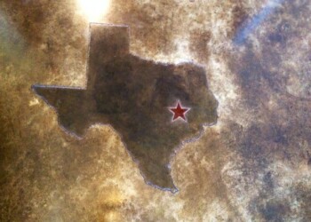 Concrete floor with a Texas-shaped engraving and a red star marking a location. Custom engraved Texas shape with a red star on a concrete surface.