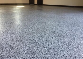 Garage floor coating completed in a residential home in Ephrata, PA. Newly coated garage floor with speckled gray finish in a residential garage.