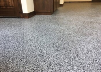 Epoxy garage floor coating installed in a residential garage in Ephrata, Pennsylvania. Finished epoxy garage floor coating with a speckled gray finish in a residential garage.