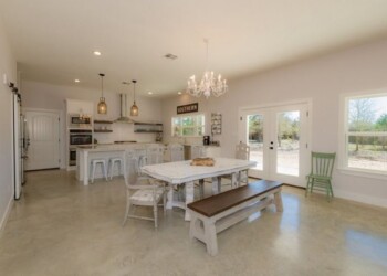 Sealed and waxed concrete floors in a modern Tennessee home. Bright, open-concept kitchen and dining area with sealed concrete floors in Eads, Tennessee.