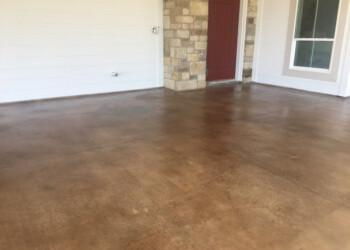 Exterior acid stained concrete porch in a residential home in Euless, Texas. Finished exterior acid stained concrete porch in a residential home.