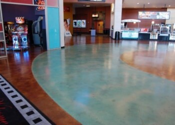 Polished concrete floor with colorful design in a commercial space. Colorful polished concrete floor in a shopping mall or entertainment center.