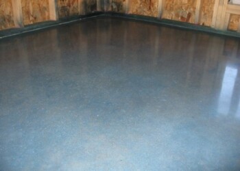 Polished concrete floor in a construction site in Ephrata, Pennsylvania. Finished polished concrete floor in a construction site with wooden walls.