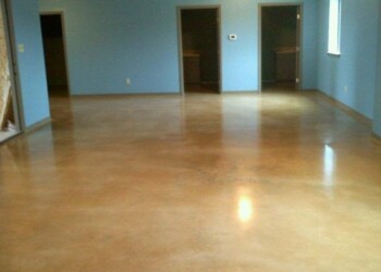 Newly polished concrete floor in a residential living room in Eads, Tennessee. Polished concrete floor in a new residential living room with blue walls.